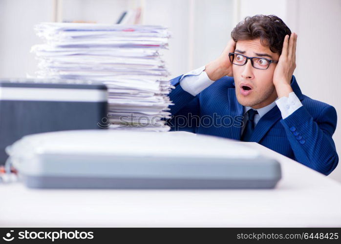 Businessman making copies in copying machine