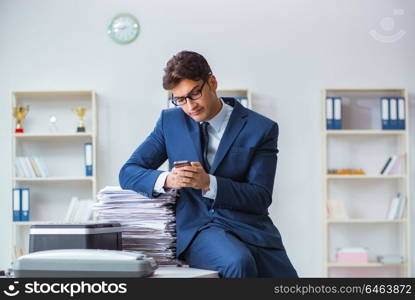 Businessman making copies in copying machine