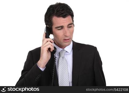 Businessman making important call