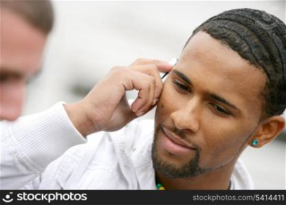 Businessman making phone call outside