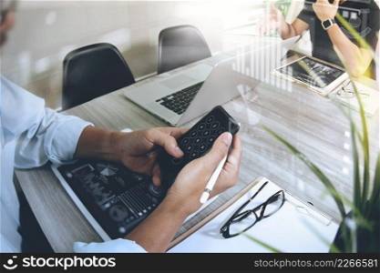 Businessman making presentation and using smart phone with his colleagues and business strategy digital layer effect at the office as concept  