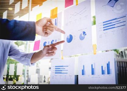 Businessman making presentation with his colleagues and business strategy digital layer effect at the office as concept.