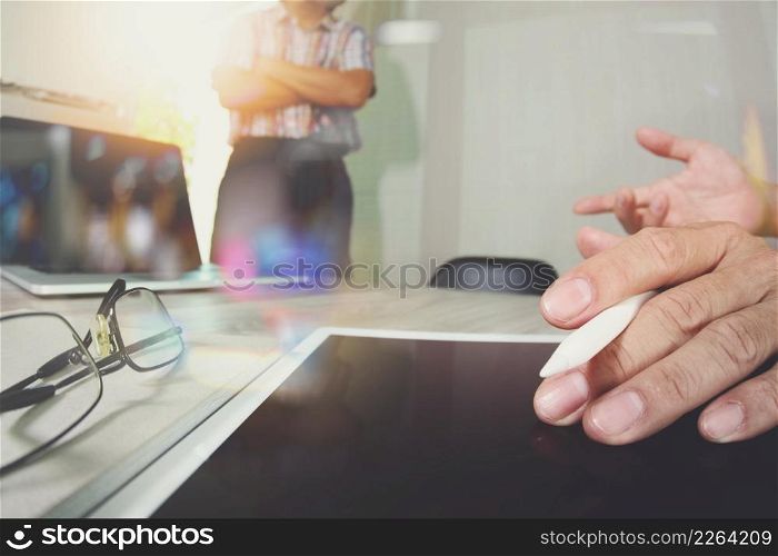 Businessman making presentation with his colleagues and business tablet digital computer at the office as concept