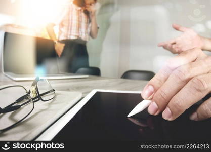 Businessman making presentation with his colleagues and business tablet digital computer at the office as concept