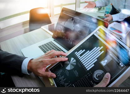 Businessman making presentation with his colleagues and business tablet digital computer at the office as concept