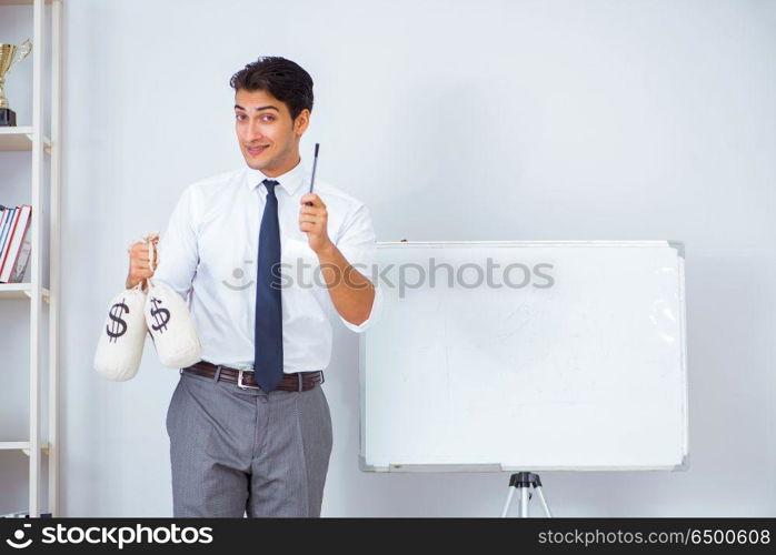 Businessman making presentation with money sacks