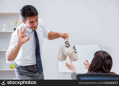 Businessman making presentation with money sacks