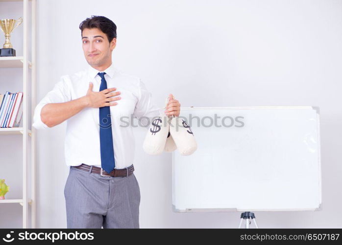 Businessman making presentation with money sacks