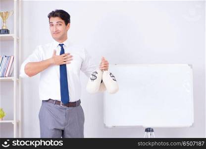 Businessman making presentation with money sacks