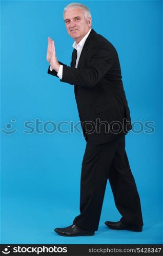 Businessman making stop gesture