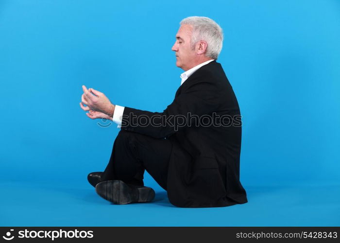 Businessman meditating