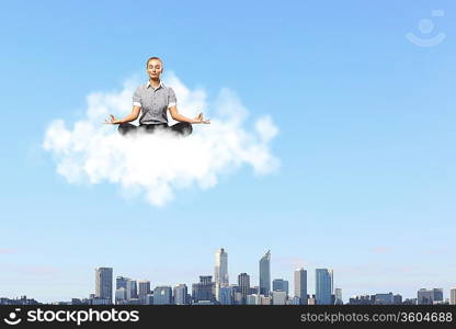 Businessman meditating sitting on the white cloud