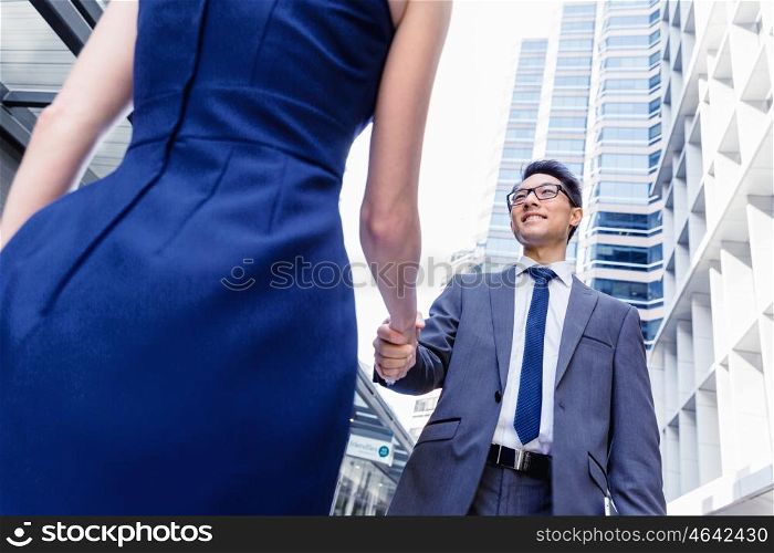 Businessman meeting his colleague outdoors. Nice talk out of the office