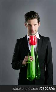 Businessman modern valentine plastic rose flower in hand over gray background
