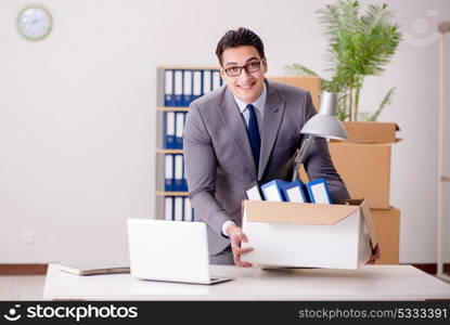 Businessman moving offices after promotion