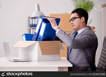 Businessman moving offices after promotion