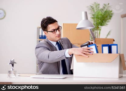 Businessman moving offices after promotion