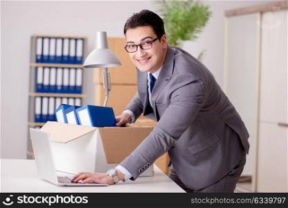 Businessman moving offices after promotion