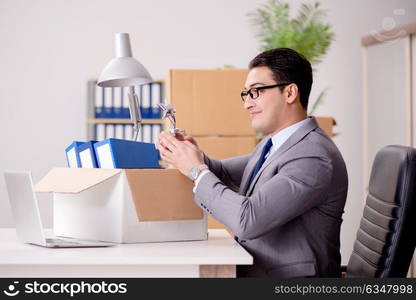 Businessman moving offices after promotion