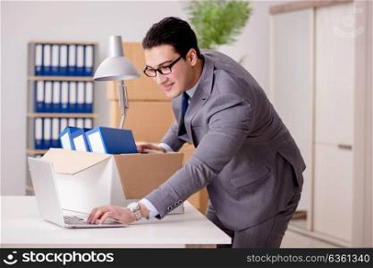 Businessman moving offices after promotion