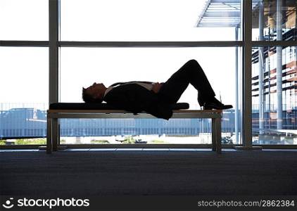 Businessman Napping on Bench