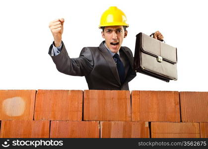 Businessman near brick wall