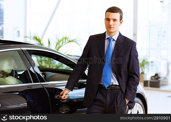 Businessman near car