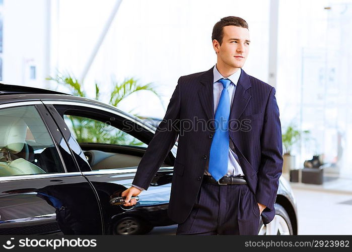 Businessman near car