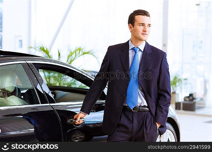 Businessman near car