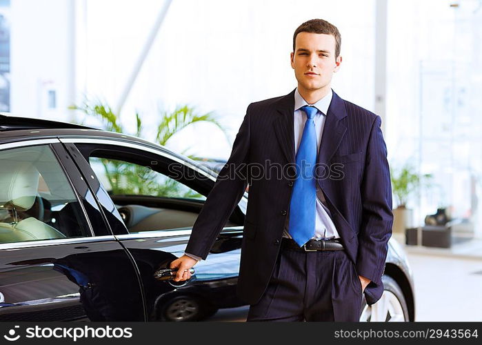 Businessman near car