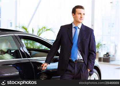Businessman near car