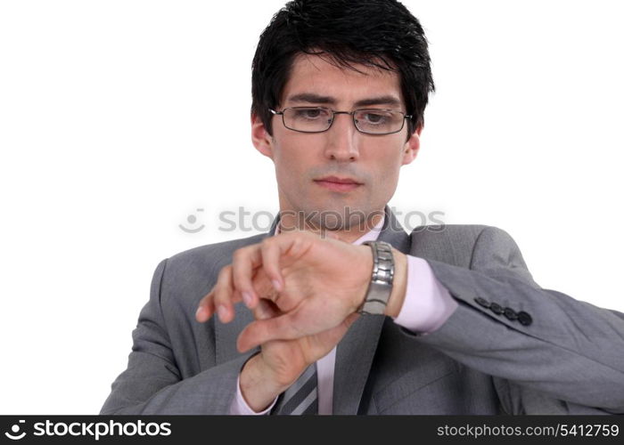 Businessman observing his watch