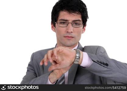 Businessman observing his watch