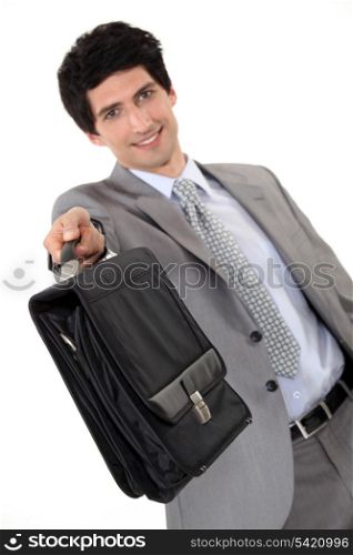 Businessman offering briefcase