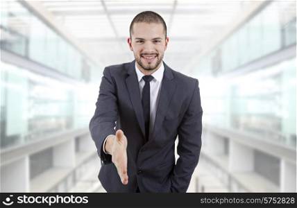 businessman offering to shake the hand, at the office