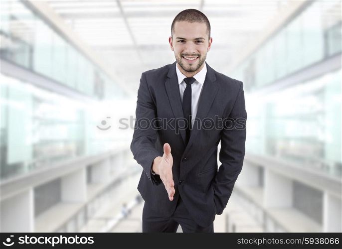 businessman offering to shake the hand at the office