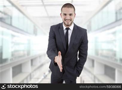 businessman offering to shake the hand at the office