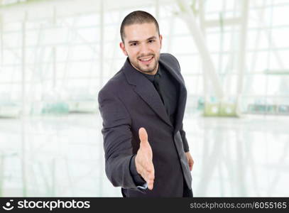 businessman offering to shake the hand, at the office