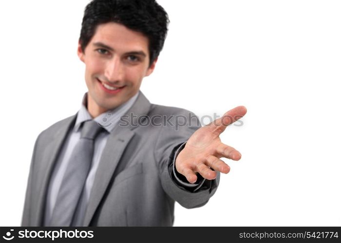 Businessman offering you his hand