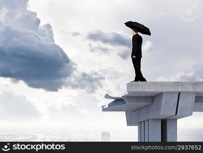 Businessman on bridge