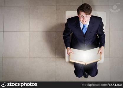 Businessman on chair. Top view of businessman sitting on chair