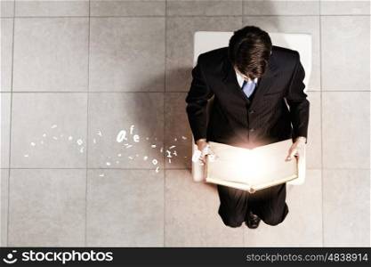 Businessman on chair. Top view of businessman sitting on chair
