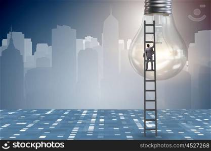 Businessman on ladder with light bulb