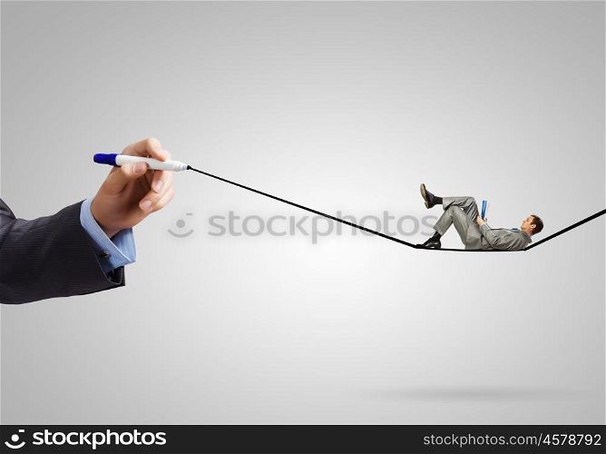 Businessman on line. Young handsome businessman lying on drawn line and reading book