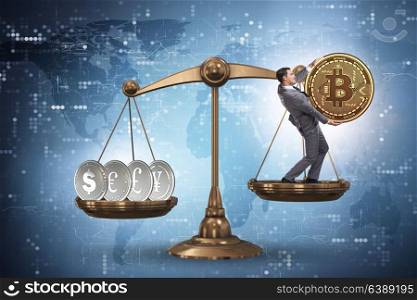 Businessman on scales with bitcoins and other currencies