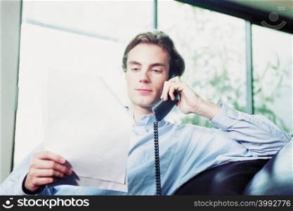 Businessman on telephone at home