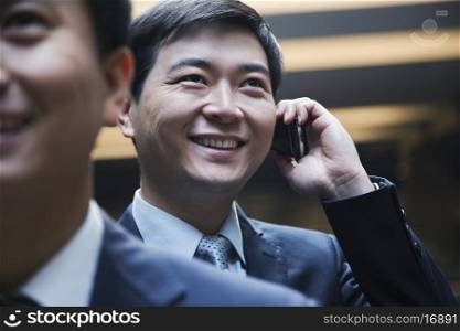 Businessman on the phone, Beijing, indoors