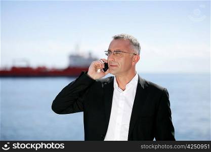 Businessman on the phone outdoors