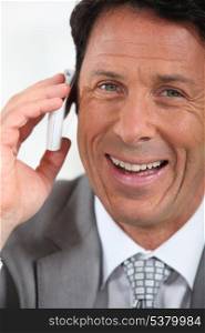 Businessman on the phone smiling