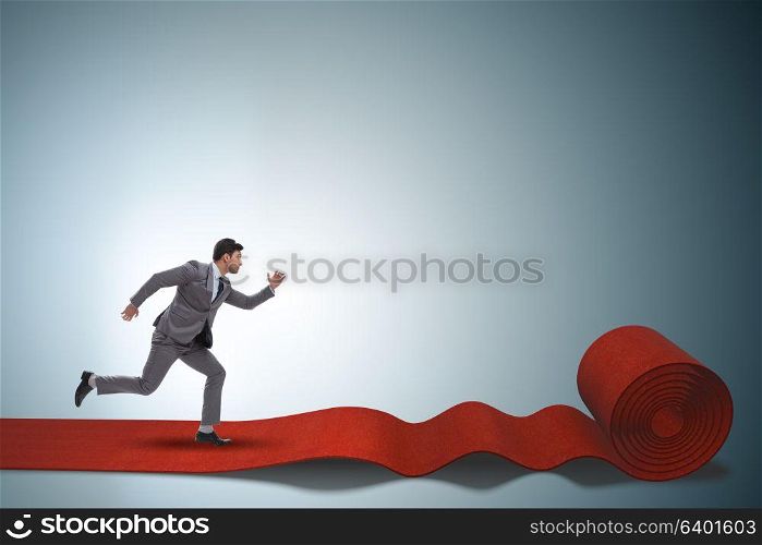 Businessman on the red carpet in success concept
